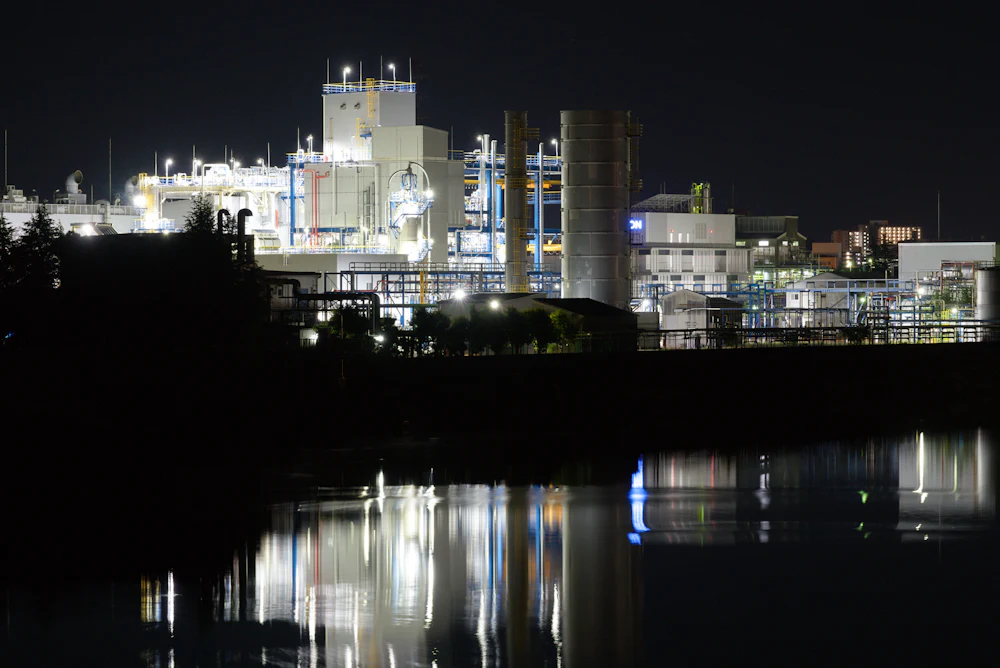 An illuminated water treatment facility at night